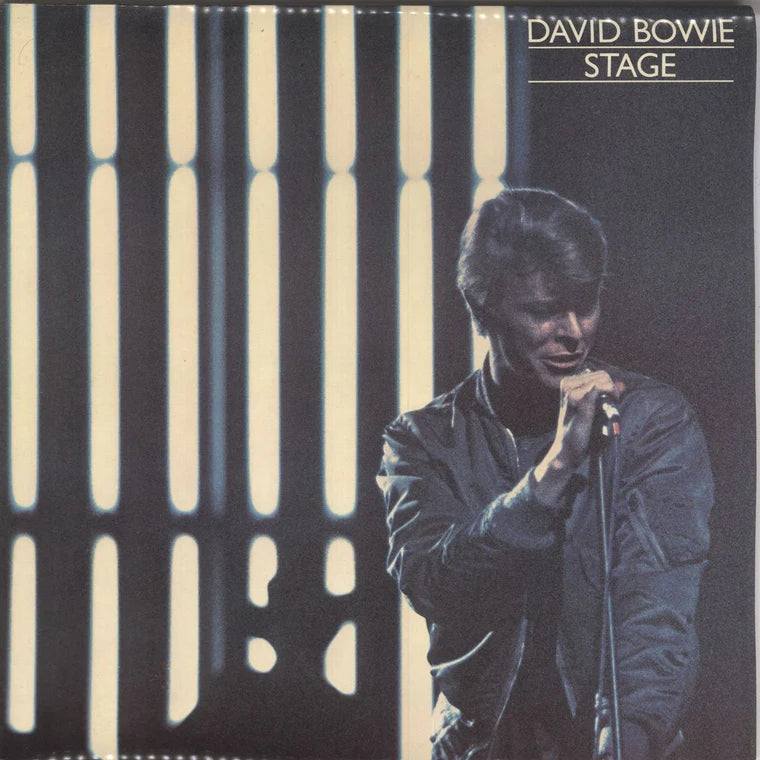 Album cover featuring a silhouette of a person on stage with vertical light patterns and 'David Bowie Stage' text.